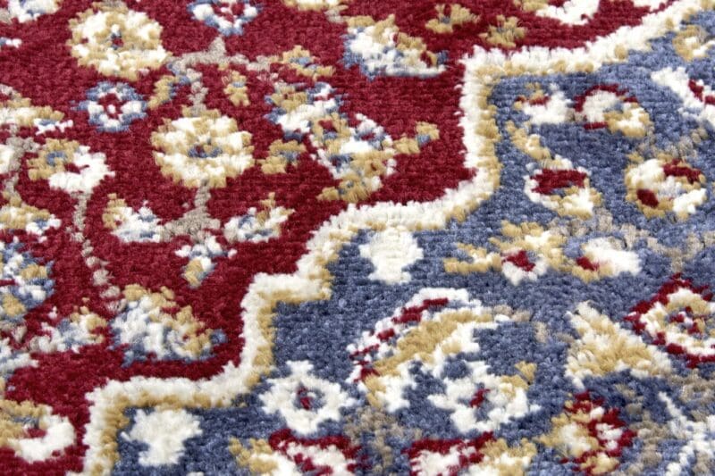 Luxor tæppe i farven Rød lavet af 100% Polypropylen med en bagside af 100% Jute / PP