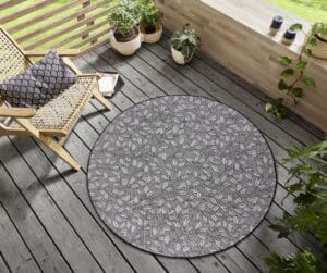 Rund Mix tæppe i farven Creme Sort lavet af 100% Polypropylen med en bagside af 100% Polypropylen